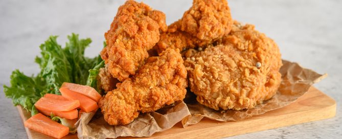 crispy fried chicken wooden cutting board
